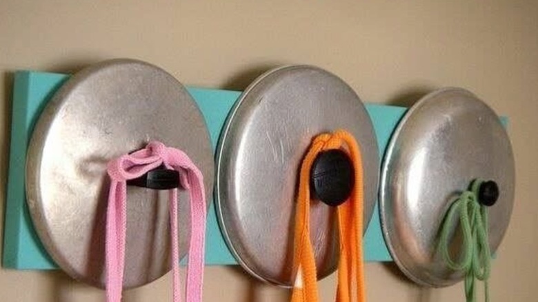 Metal pot lids as wall hooks
