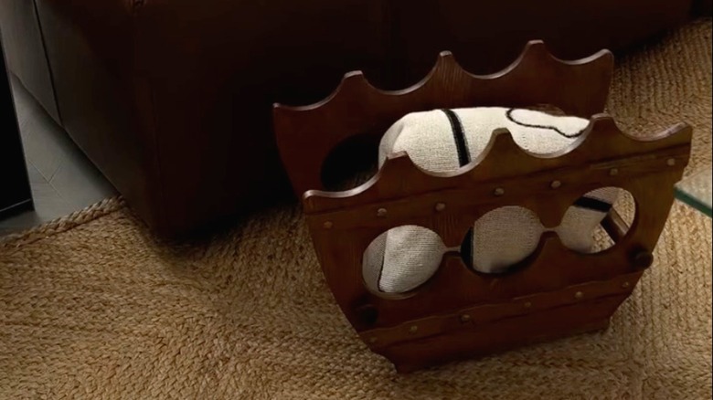 A DIY blanket box made from a wooden wine rack