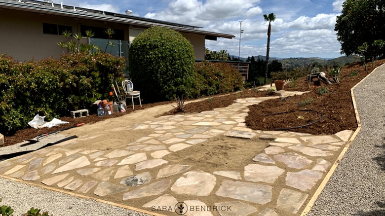 Work-in-progress example of cobblestone-patio design from broken concrete