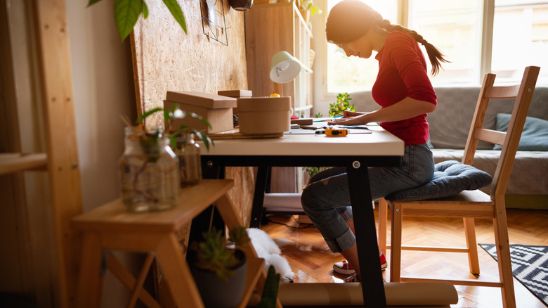 A woman working on a craft