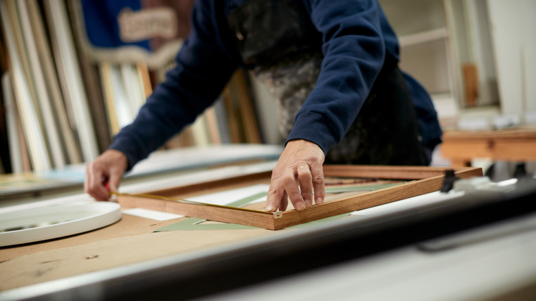 Person framing art