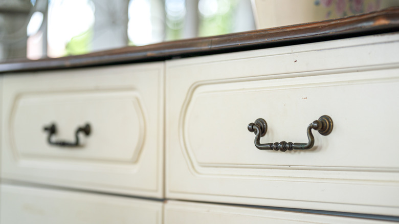 white drawer with metal hinged pulls