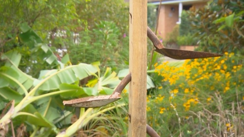 bird feeder in garden made from shovel