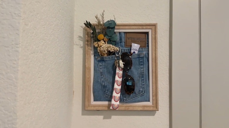 Jeans key holder frame mounted on wall