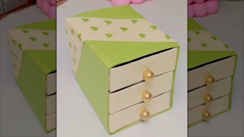 Upcycled matchboxes into an organizer for tiny things.