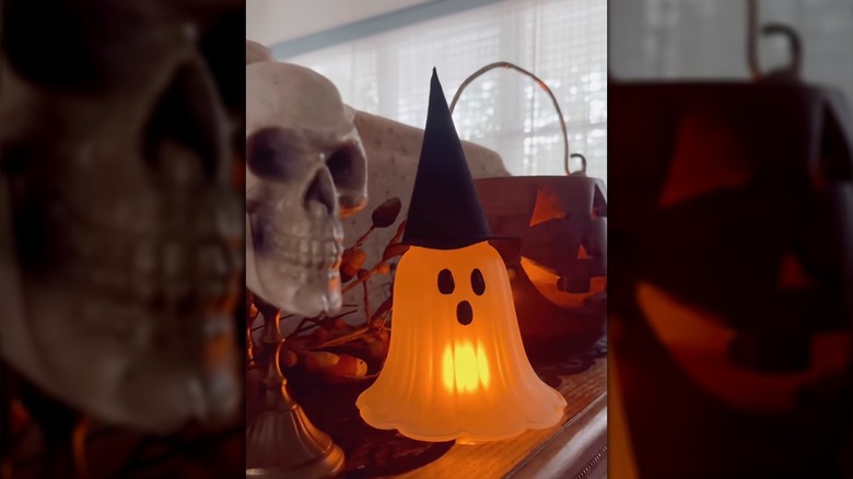 A DIY glowing ghost made from a frosted lamp shade
