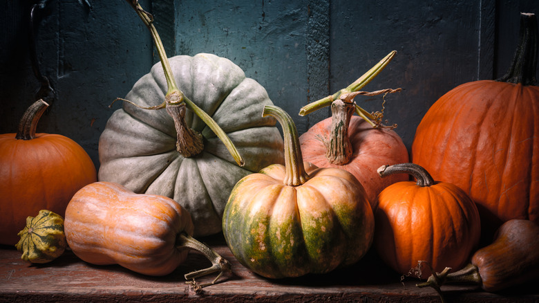 A cluster of pumpkins in a fall arrangement
