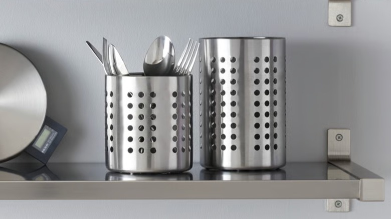 ORDNING utensil holders on a chrome floating shelf with utensils in it