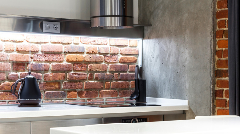 industrial style kitchen with brick metal and concrete