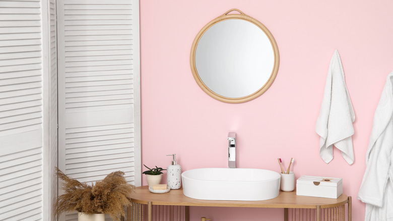 Interior of a pink bathroom.