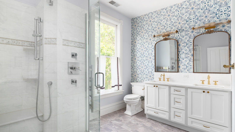 A bathroom with a wallpaper feature wall