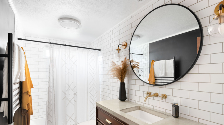 A bathroom with classic white subway tile.