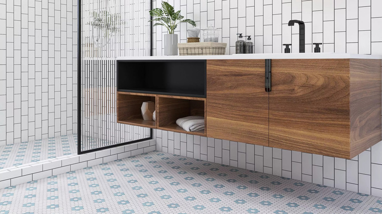 A bathroom with a floral hex tile pattern