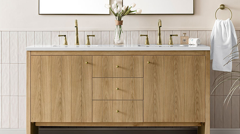 A natural wood vanity in a bathroom