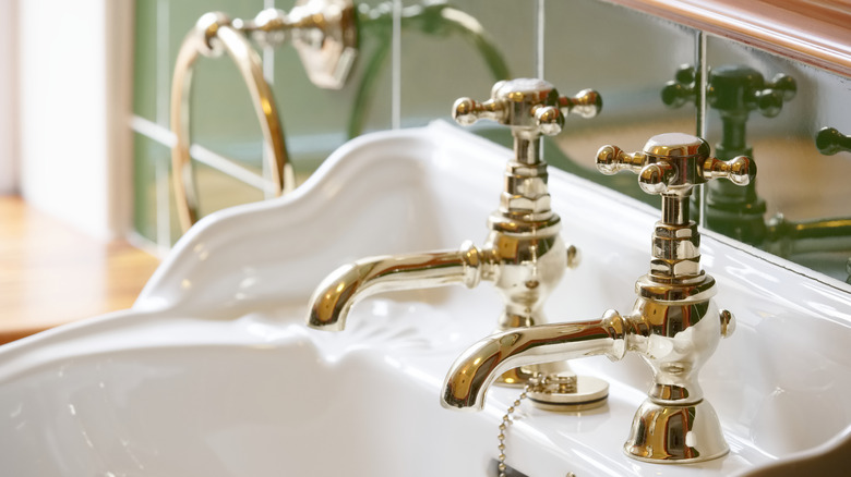 Vintage-inspired gold sink faucets