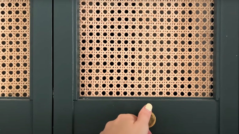 Charming wooden closet door with rattan caning pattern