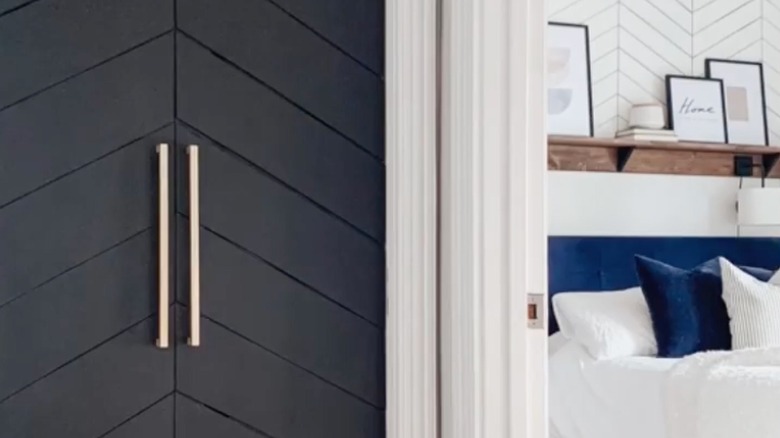 Diagonal pattern closet door with long, rustic bar pulls