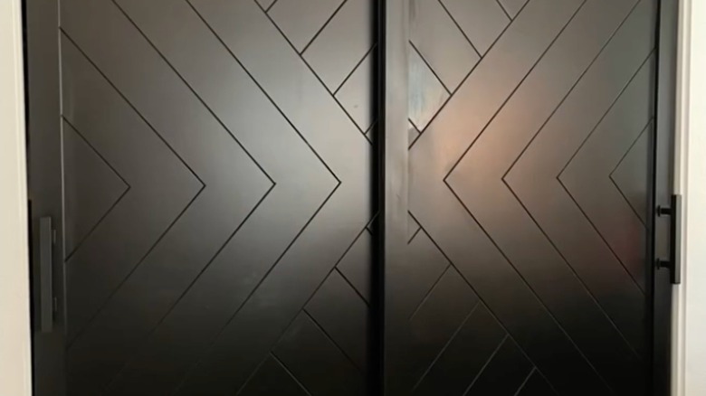 Dark closet doors with herringbone pattern