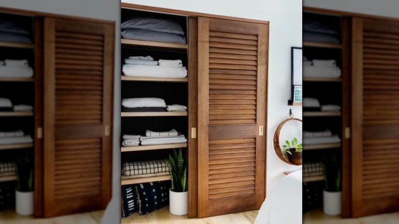 Louvered closet doors with wood stain finish