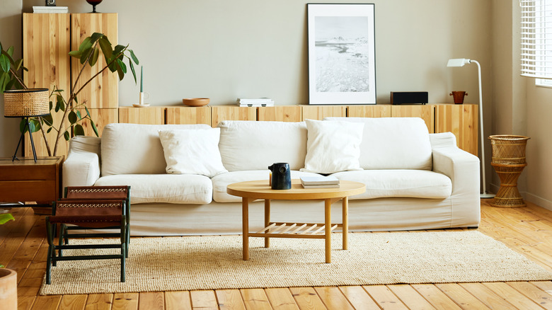 White couch with plain white throw pillows
