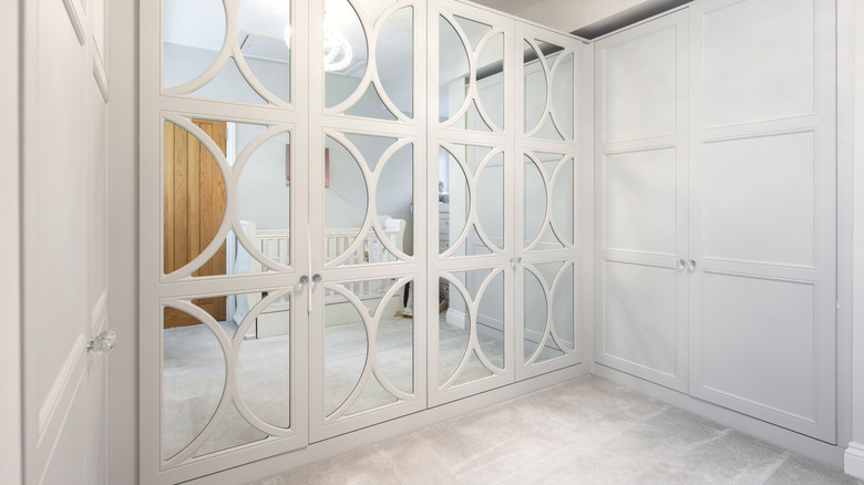 mirrored closet doors with patterned overlay