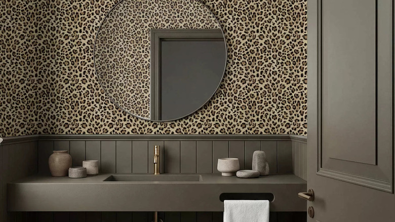 Vanity in with blue patterned wallpaper