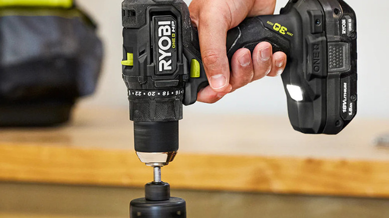 A person using Ryobi's Limited Edition 18V One+ HP Compact Brushless 1/2-inch drill/driver