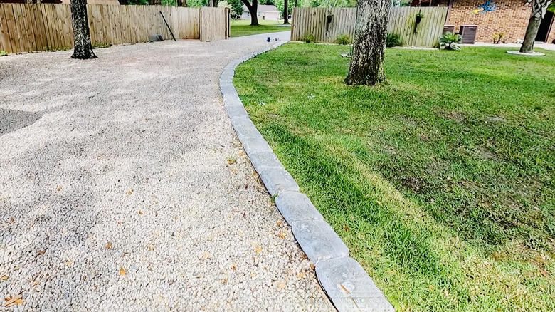 Driveway border made from hardened bags of concrete.