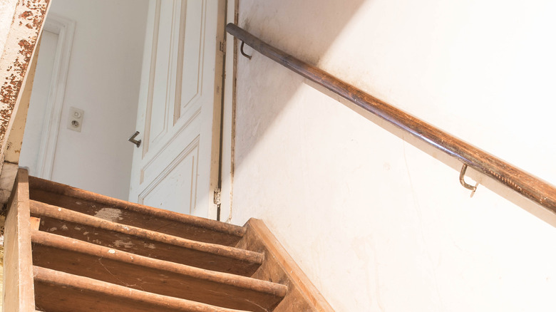 Open basement door with stairs