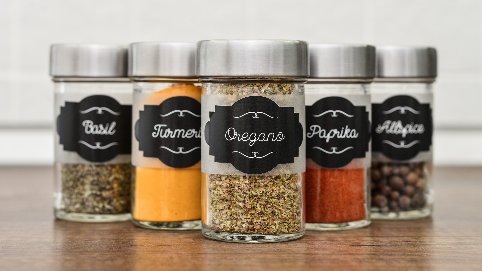 https://www.housedigest.com/img/gallery/upgrade-your-kitchen-organization-with-these-diy-magnetic-spice-jars/l-intro-1703858171.jpg