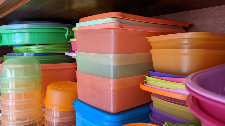 Stacks of plastic food containers and lids