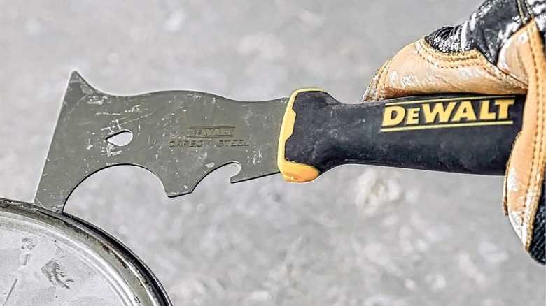 DeWalt 9-in-1 Painter's Tool opening a paint can