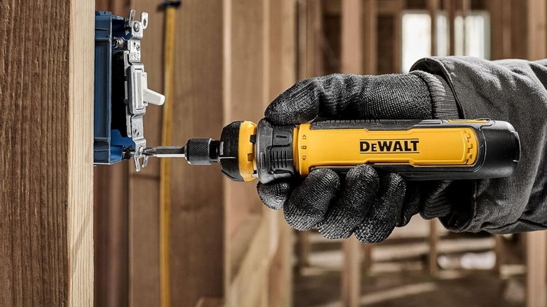 DeWalt Cordless Screwdriver being used on a light switch