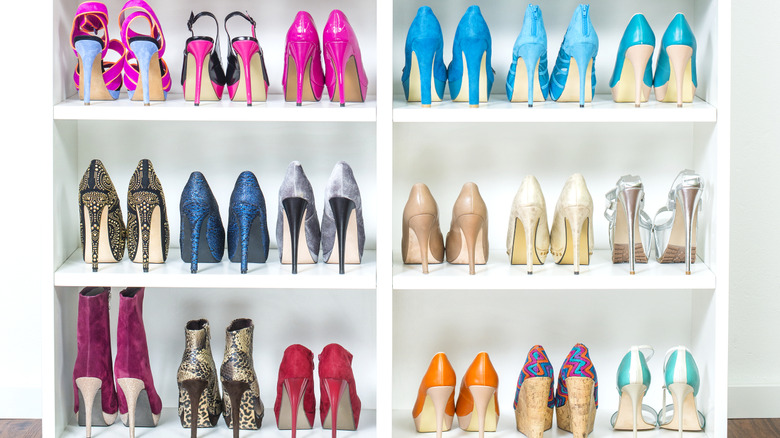 A Shoe Closet (wardrobe) with lots of colorfull High Heels shoes.