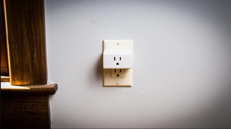 KASA plug plugged into a wall outlet