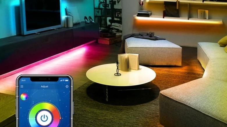 Smart lights installed in a living room on the bottom of shelves and furniture