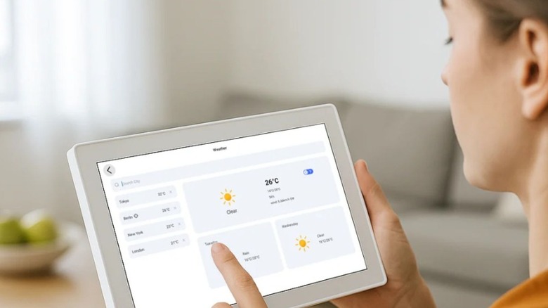 Woman holding the calendar looking at the weather