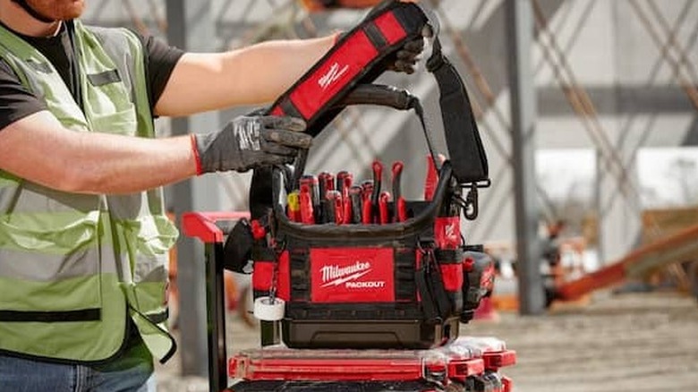 The Milwaukee Structured Tote interlocked with the Packout rolling tool box system