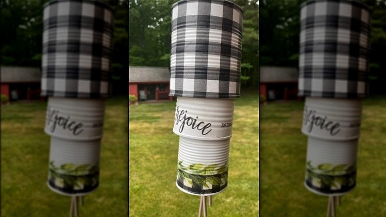 Rustic wind chime made from cans and paper napkins
