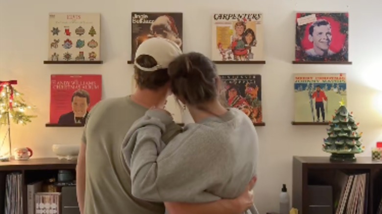 Couple looking at their Christmas-themed vinyl wall