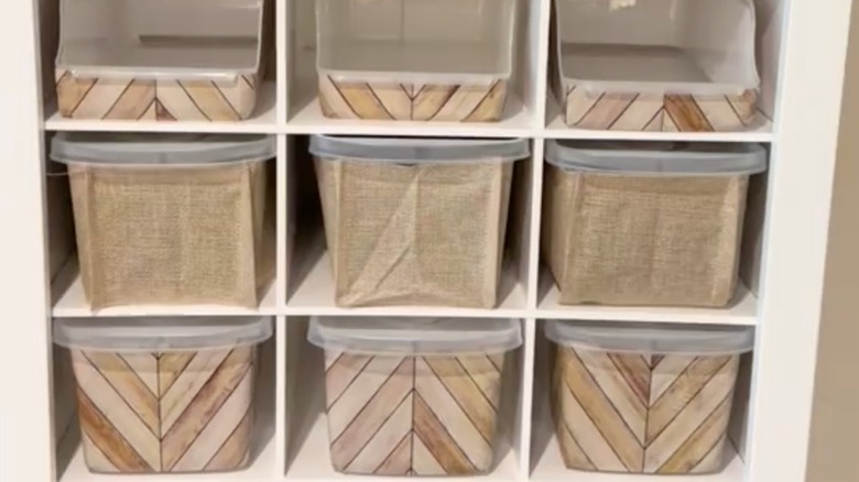 screenshot from DIY of contact paper-covered plastic bins on a shelf