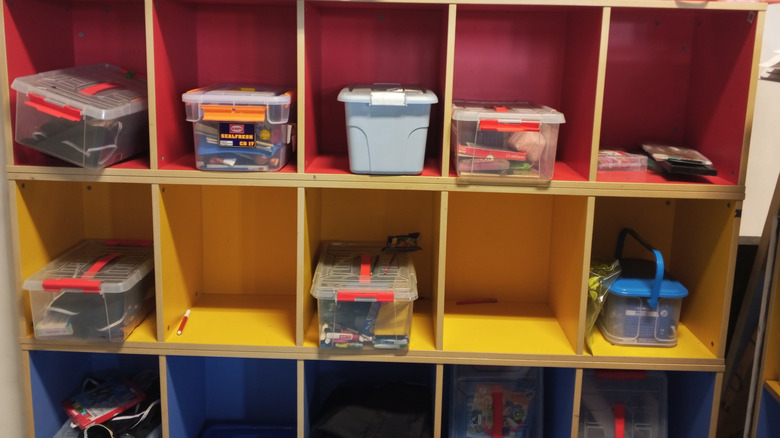 plastic storage bins on a shelf