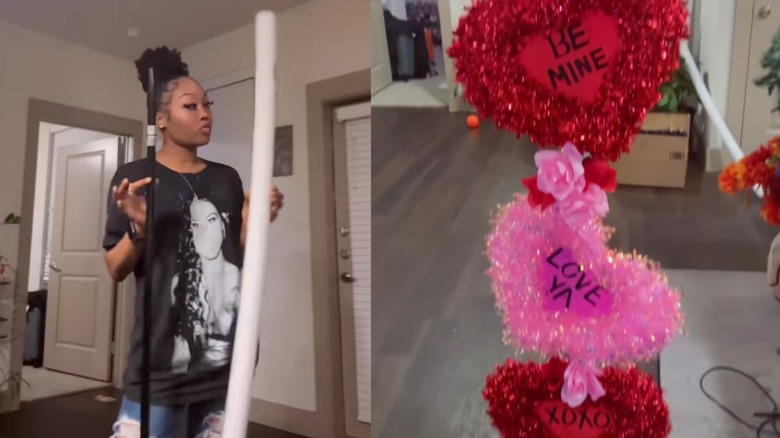 A women uses a pool noodle to create a tall Valentine's Day creation for her entryway