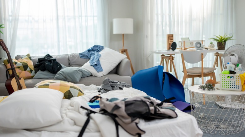 A large cluttered living room space
