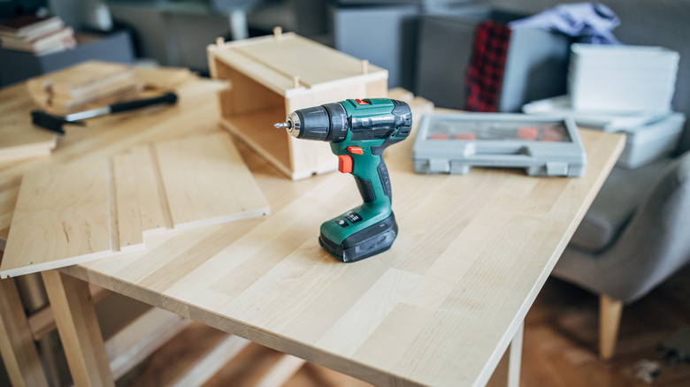 A wooden table in the process of being made or put together.