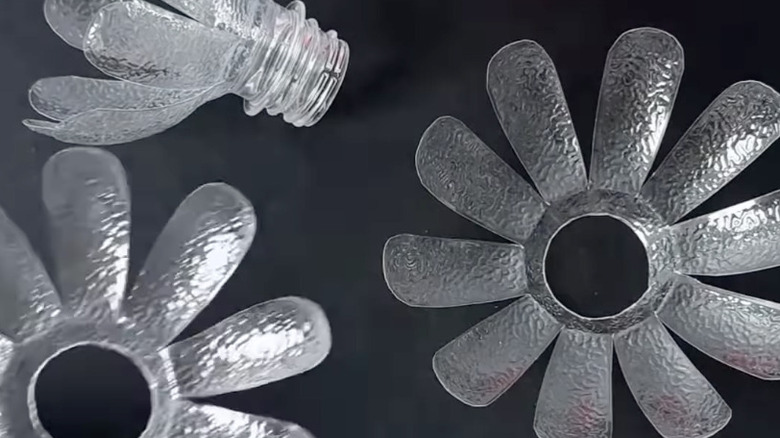 Three separate layers of an unassembled water bottle lotus flower