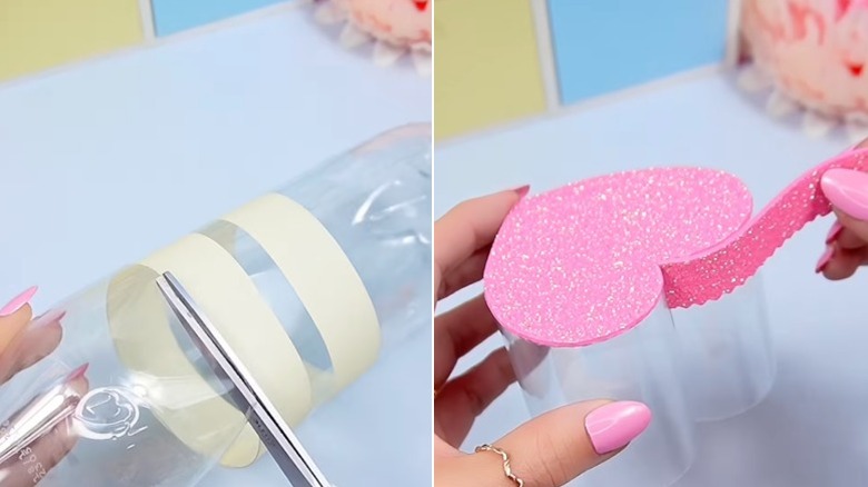 Cutting a plastic bottle in half along lines of tape and adding a border of glittery pink foam to plastic shaped into a heart.