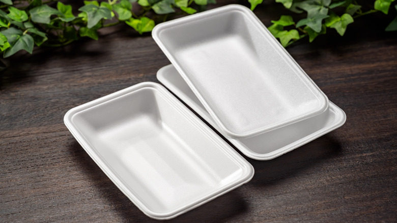 Styrofoam trays on wooden table