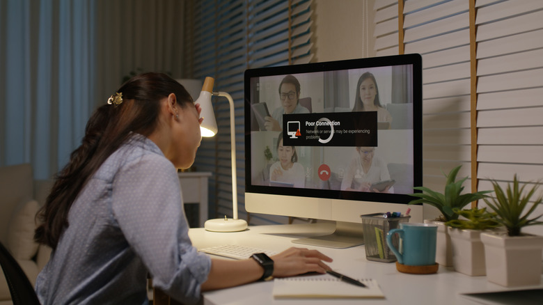 Stressed woman on a video call with poor connectivity