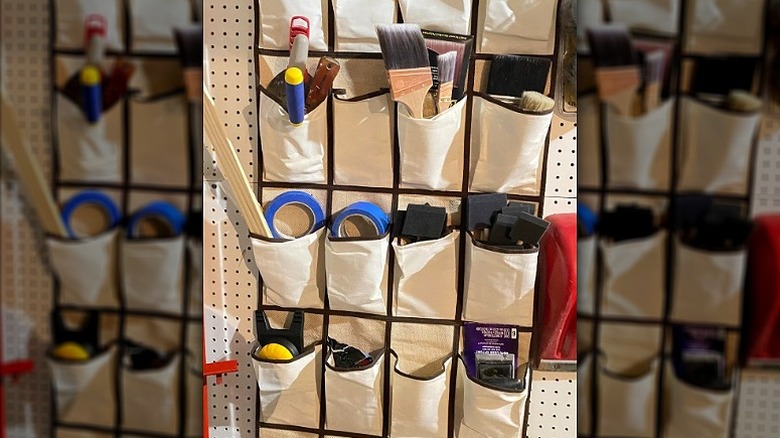 Pocket organizer holding various tools in garage